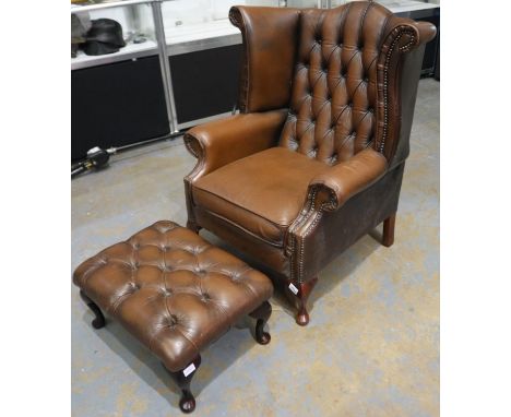 20th century brown leather button-back Chesterfield fireside wing back armchair, with associated footstool (2). Not available