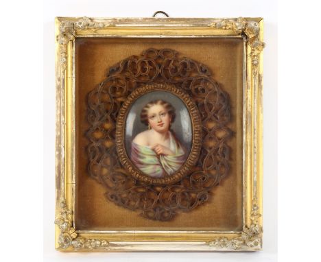 19th century miniature painting on porcelain, portrait of a woman, in carved and pierced wood frame and outer gesso cabinet f