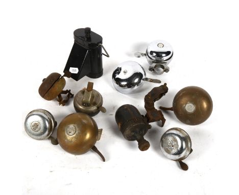 A collection of bicycle bells, and a blackout lamp 