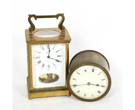 A reproduction brass-cased carriage clock, by Estyma, and a brass-cased drum clock, diameter 10cm (2) 