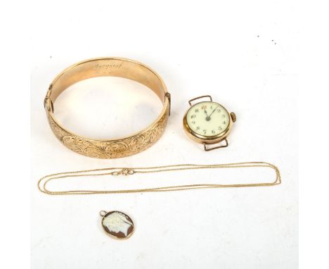 A gold-cased lady's wristwatch, a 9ct gold cameo locket and chain, and a gold plated metal core bangle 