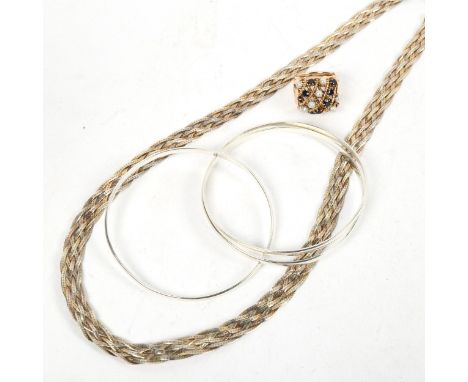 A silver interwoven flat link necklace, a silver Trinity style bangle, Munu? ring 
