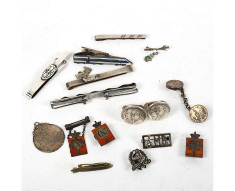 A collection of silver and red enamel badges, silver tie clips, including makers Graf Zeppelin 