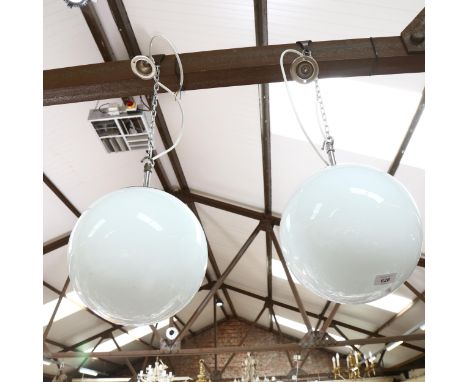A pair of milk glass globular pendant light fittings, diameter 22cm 