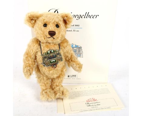 A Steiff blonde teddy bear with certificate, 32cm 