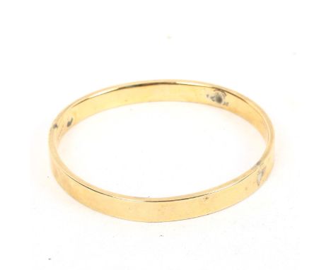 A 9ct gold bangle, with inscription, 9.9g 