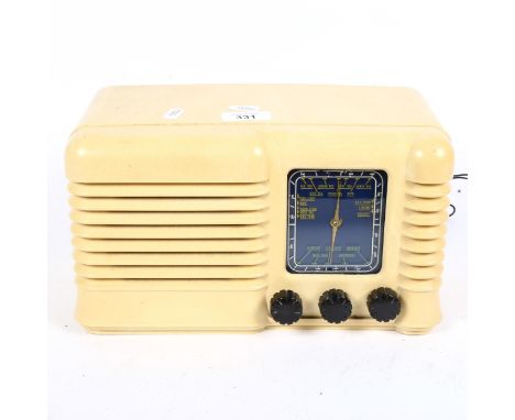 A Vintage cream Bakelite radio, width 30cm, height 17cm 