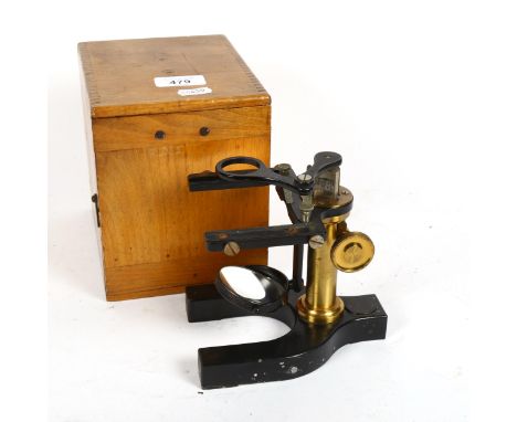 A Vintage brass-mounted student's microscope, by Bausch & Lomb, New York, cased, height 16cm 