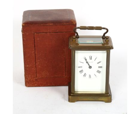 A brass-cased carriage clock, by Dobell Brothers of Hastings, height 11cm, in red leather travelling case, working order 