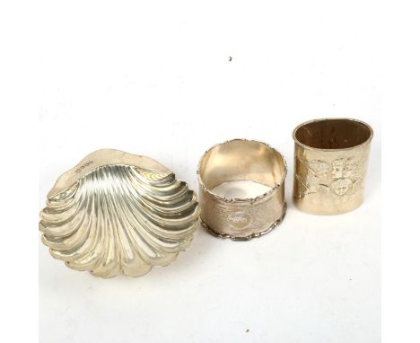 A small shell design silver butter dish, a silver napkin ring, and an Art Nouveau silver pot with mother-of-pearl base (3) 