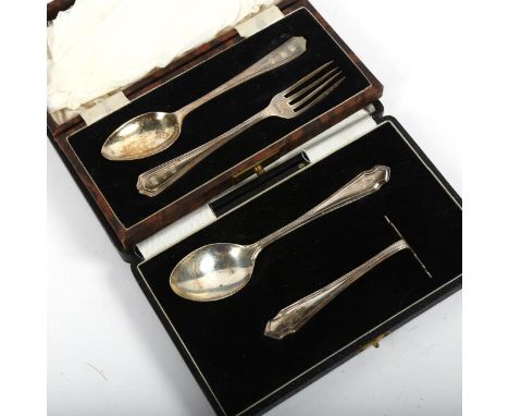 A silver baby's spoon and pusher, and a silver teaspoon and fork (both cased) 