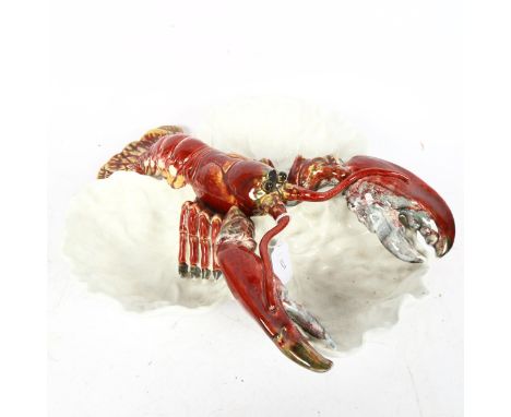 A large pottery lobster hors d'oeuvres dish, marks on base, diameter 34cmTail has been broken and re-glued, and rostrum has b