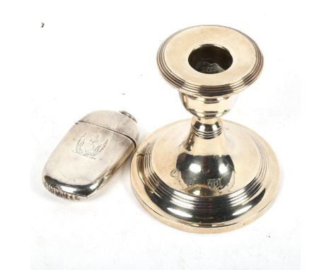 A Victorian silver Vesta case, Birmingham 1883, maker's marks for Howard James, monogramed, and a squat silver candlestick (2