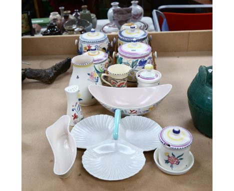A group of Poole pottery, including painted biscuit jars and covers, preserve pots etc 