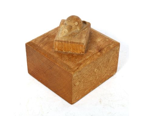 A carved oak mouse block paperweight, attributed to Robert Mouseman Thompson, width 10.5cm, height 10cmSome minor water stain