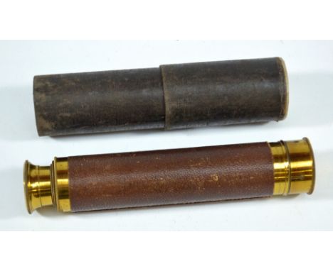 An unnamed 1" brass three-draw telescope, indistinctly inscribed to the end cap and in partial card tube, length 15.5cm.