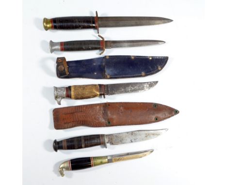 Two small Bowie knives, one with hawk pommel and stag grip, in associated leather scabbard, a further in scabbard and three s