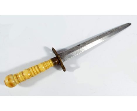 A 19th century dagger with turned bone handle, pierced eagle crossguard and tapering blade, length 21.5cm. CONDITION REPORT: 