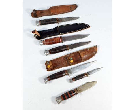 A small Bowie knife in simple scabbard, the blade stamped 'Original Bowie Knife, Solar', two further small Bowie knives and t