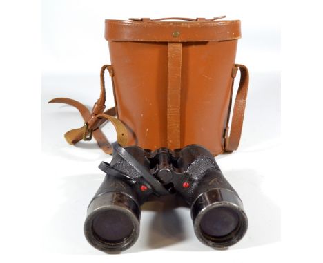 A pair of military issue binoculars inscribed 'C.G.B. 40M.A 7x50 28135-C, Patt 2/1900 Rel/Canada 1945', and bearing military 