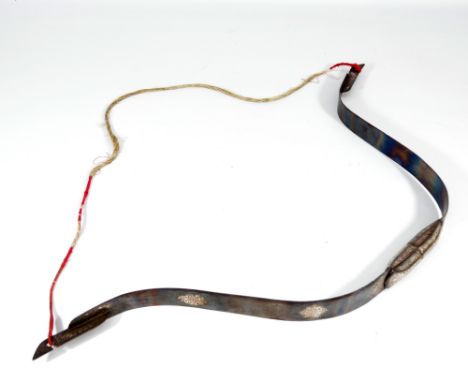 A late 19th/early 20th century Indian two-piece floral engraved steel bow, string replaced, length 74cm.