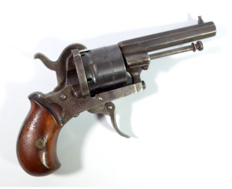 A pinfire six shot revolver with octagonal barrel, folding trigger and walnut stock, the cylinder inscribed 'The Guardian, Am