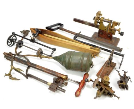 A quantity of tools to include lathes of varied sizes, clamps/vices, two pneumatic devices, stamped for Talbot London and W.T