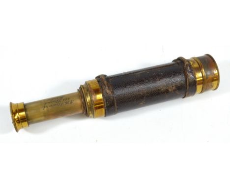 JH STEWARD, 406 STRAND, LONDON; a 1" brass three-draw telescope with stitched leather barrel, length 15.5cm.