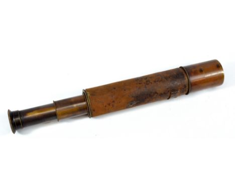 JB DANCER OF MANCHESTER; a 1.5" brass three-draw telescope, with stitched leather barrel, length 26.5cm.
