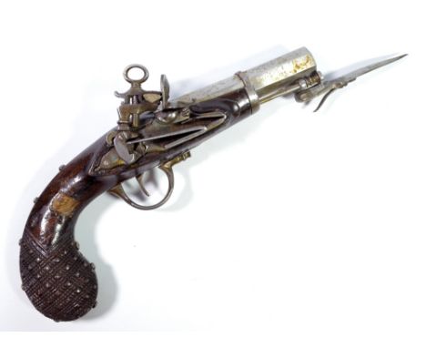 A small miquelet lock pocket flintlock pistol with octagonal steel barrel bearing stamp 'FM', spring loaded dagger, steel fur