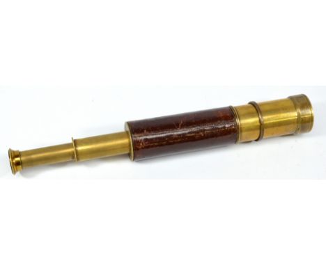 TROUGHTON & SIMMS OF LONDON; a brass 1.5" two-draw telescope with delineated primary tube and stitched leather and brass barr