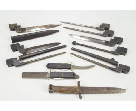 A group of predominantly 20th century bayonets to include three military issue examples with broad arrow marks and further Br