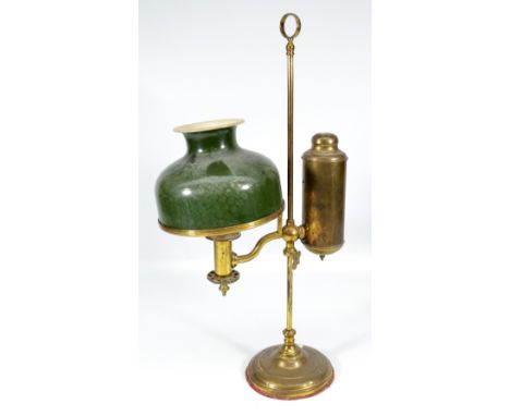 A 19th century brass student's lamp with repainted cream and green shade, side cylinder and weighted base with adjustable cen