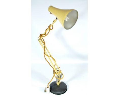 HERBERT TERRY; an original mid-20th century cream painted Anglepoise lamp on probably replacement circular base.