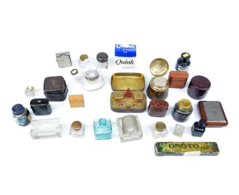 A collection of travelling inkwells and other inkwells, also two glass stamp rollers.