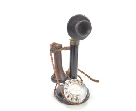 An early 20th century candlestick model telephone, the mouthpiece stamped 'S-29/4001 No. 1', the dial with a printed label fo