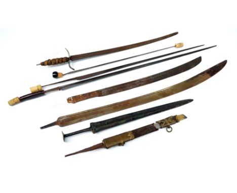 A group of swords and blades including a Spanish cross-hilted example with engraved Toledo blade and woven grip, two partial 