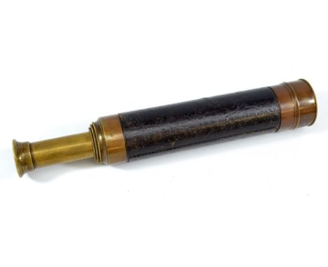 J CASARTELLI & SON, MANCHESTER; a 1.25" brass three-draw 18X telescope with stitched leather barrel, length 20.5cm.