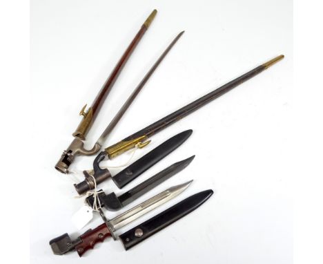 A military issue socket bayonet with broad arrows and War Department stamps, in leather scabbard, another similar socket bayo