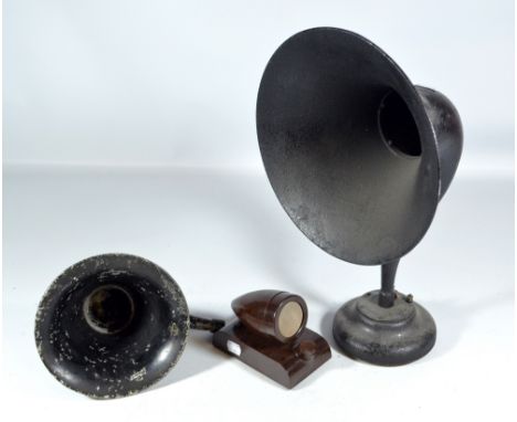 A tin loud speaker on circular base, a small horn and a bakelite speaker (3).