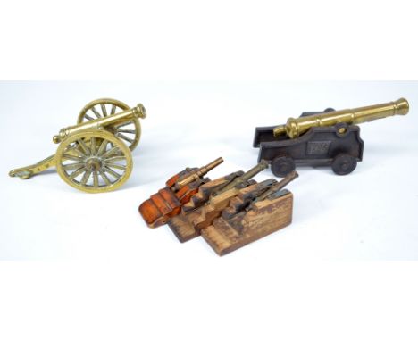 A group of five model cannons to include two larger brass examples, one on iron base inscribed to sides '1796' (5).