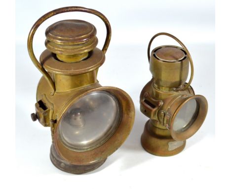 LUCAS; a brass 'King of The Road' lamp, no.634, with loop handle, height 27cm, and a similar larger example by Dietz, height 