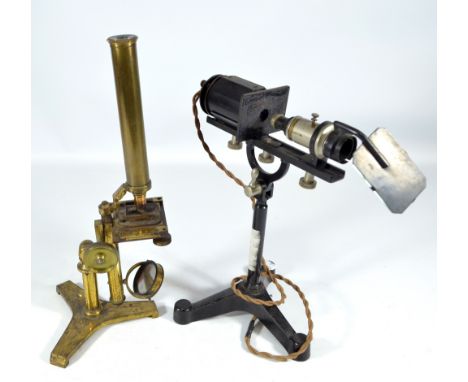 An unnamed brass monocular microscope with hinged tripod base, height 39cm, and a George & Becker Ltd tripod mounted lens wit