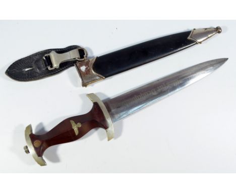 A WWII period German Third Reich SA dagger, with inset detail to the brown grip and Gustav Voss of Solingen inscribed blade, 