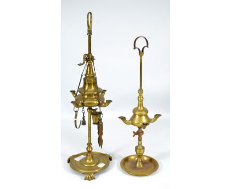 A 19th century Colza brass four branch oil lamp with turned circular base and three scrolling feet, height 50cm and a further