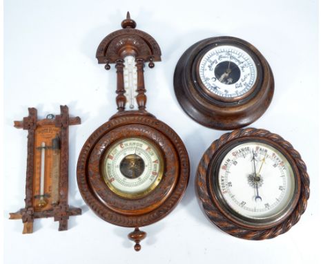 Four early to mid-20th century barometers including oak cased banjo example, length 45cm, and a Wood's Strom Glass example, l