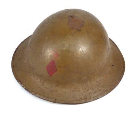 A British WWI period Brodie type helmet with textured finish, with internal leather liner and chin strap. CONDITION REPORT: G