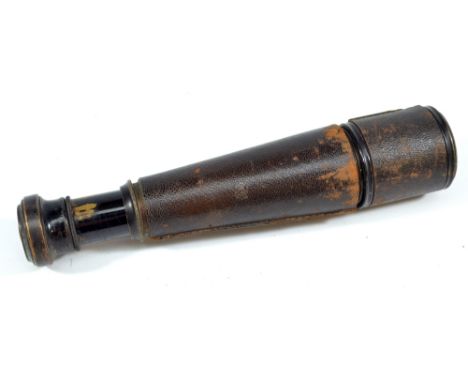 WATSON & SONS; a 1.25" lacquered brass single-draw telescope with stitched leather barrel, length 18cm.