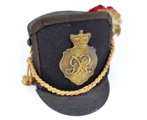 An early 20th century black cloth high fronted and peaked military dress hat/cap with G R Royal cipher brass badge to the fro