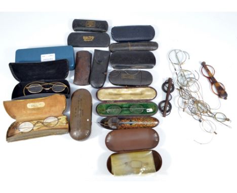 A large collection of vintage glasses including many 19th century examples, some 18th century steel examples, some in associa